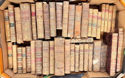 a box full of old books sitting on a table