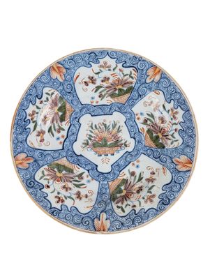 an image of a blue and white plate with flowers on it