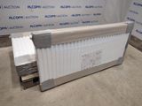 an image of a radiator sitting on top of a floor next to a wall