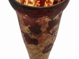 a vase that has a flower in it on a stand