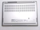 a laptop that is sitting on a white surface
