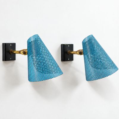a pair of wall lights in the style of person