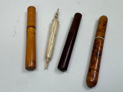 three different types of pens are lined up on a white surface