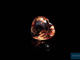 a brown diamond on a black background