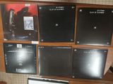 a lot of cd ' s on a shelf in a room