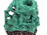 a green sculpture that is sitting on top of a table