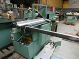 an image of a machine that is working on a piece of metal
