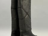 a close up of a pair of black boots on a white background