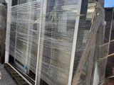 a large stack of pallets sitting on a pallet in a warehouse