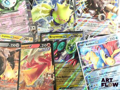 a lot of pokemon cards that are on the table