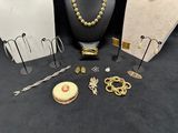 a lot of jewelry on display on a black table