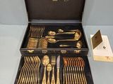 a black case with silverware in it on a table