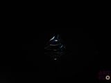 a small boat floating in the water at night