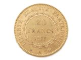 a close up of a gold coin with a wreath on it