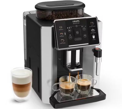 gros plan d'une machine à café avec deux tasses de café