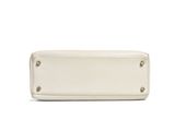 a white purse sitting on top of a white surface