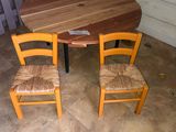 two chairs and a table in the corner of the room
