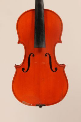 an orange violin with a black bow hanging from it ' s back