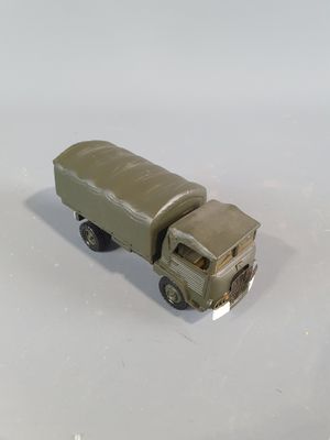 a toy truck that is sitting on a white surface
