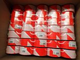 several rolls of red and white tape in a cardboard box