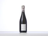the bottle of champagne is sitting on the table