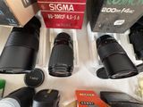 many cameras sitting on a table next to each other