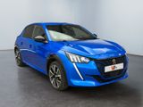 a blue car is parked in a room with a black floor
