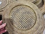 a person holding a basket that has a lot of plates on it