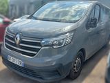 a grey van that is parked in a parking lot