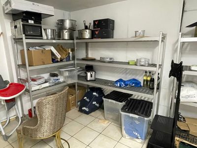 a room that has a lot of shelves and a chair in it