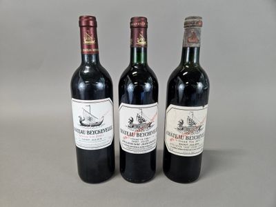 three bottles of wine sitting next to each other on a table