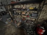 a room with a bunch of tools on the shelves