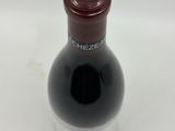 a bottle of wine that is sitting on a table