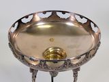 an image of a silver plate on a stand on a white background