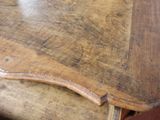 a close up of a table with a wooden top