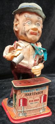 a statue of a man with a hat on top of a box