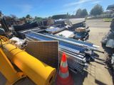 a large pile of construction equipment sitting on the ground