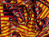 a close up of a red, yellow and black striped fabric
