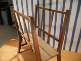 a wooden chair that is sitting on a wooden table
