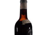 a bottle of wine that is sitting on a table