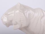 a white statue of a lion on a white background