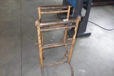 a ladder that is sitting on the floor in front of a machine