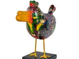 a colorful bird that is standing on a black base