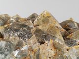 a close up of a pile of rocks on a white surface