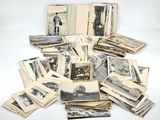 several old black and white photographs of men and women on a table