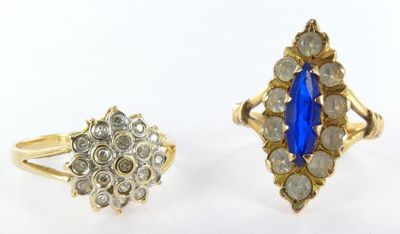 two rings, one with a blue stone and the other with diamonds