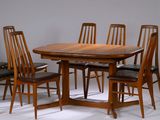 a large wooden table with six chairs around it