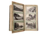 an open book with pictures of a landscape in it