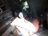 an old air conditioner sitting in the corner of a room