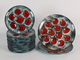 two plates with red hearts on them sitting on a table